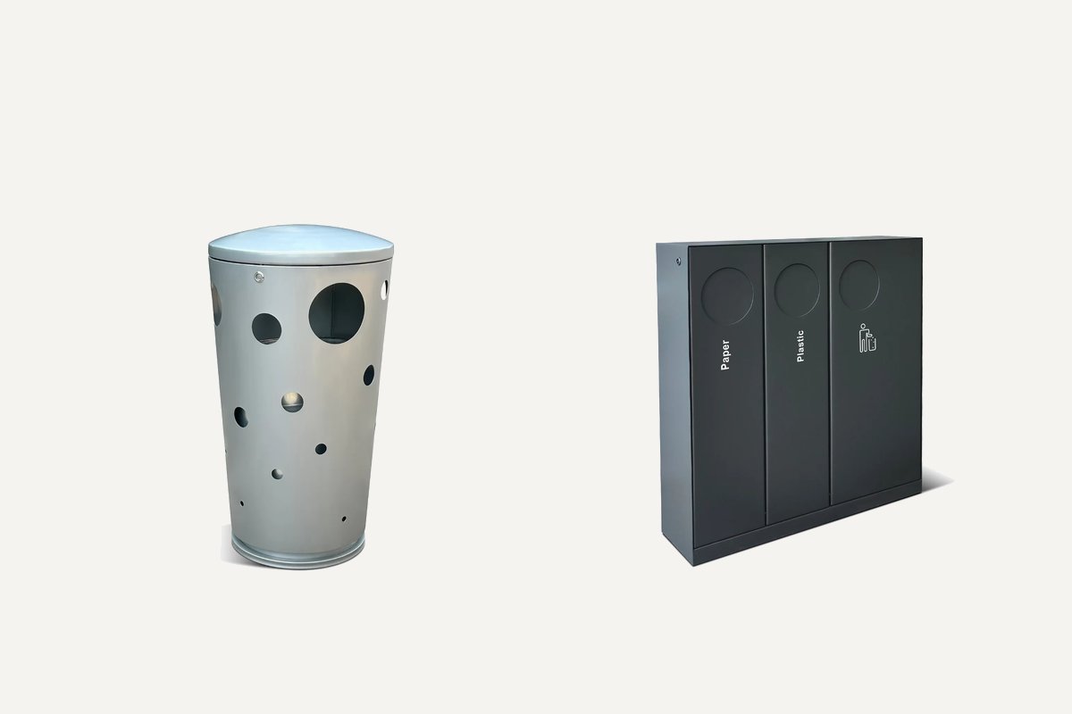 Comparison of a light grey stainless steel litter bin and a dark powder-coated steel recycling bin photographed against a neutral background