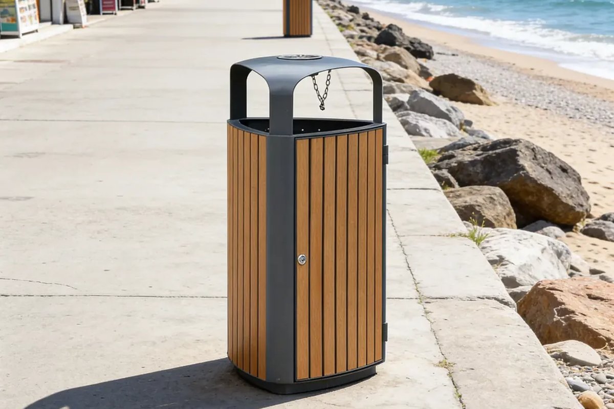 Single hardwood-clad outdoor litter bin standing on a seaside promenade walkway